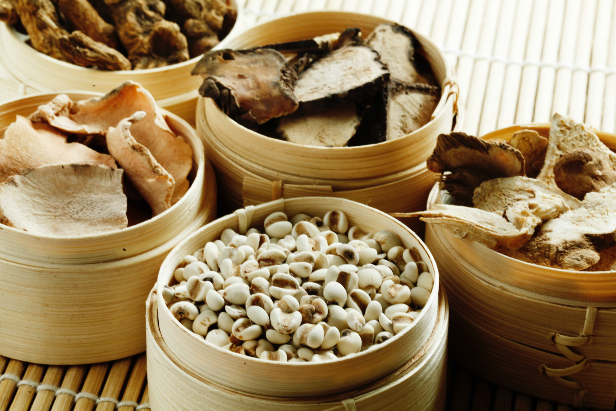 A photo of Chinese herbs in containers