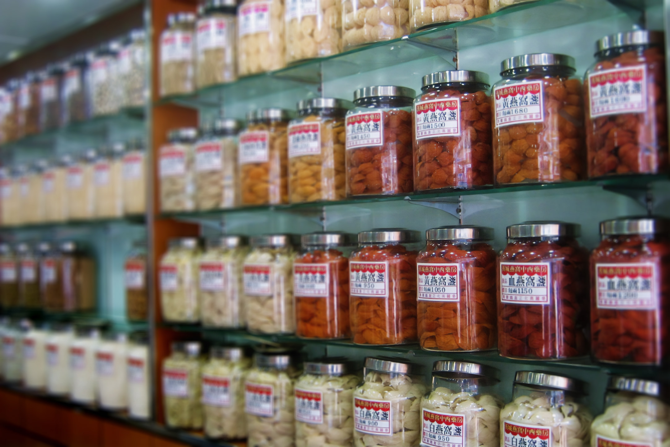 A photo of Chinese herbs in glass containers